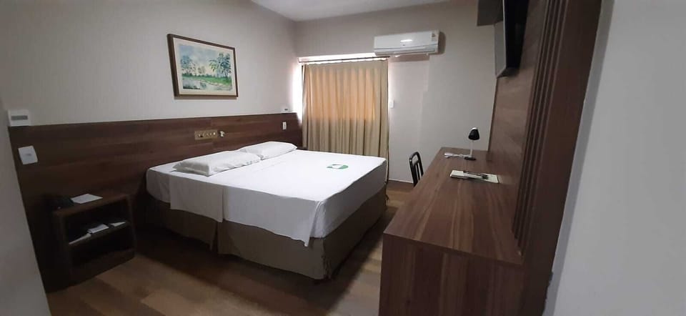 Standard Double or Twin Room | Minibar, in-room safe, desk, blackout drapes
