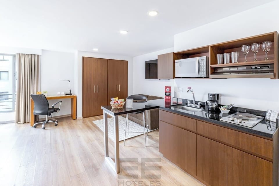 Suite, 2 Double Beds | Private kitchen | Fridge, microwave, stovetop, griddle