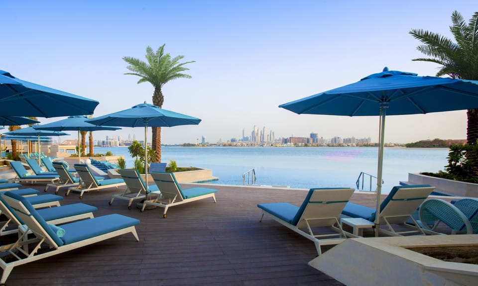 Outdoor pool, pool umbrellas, sun loungers