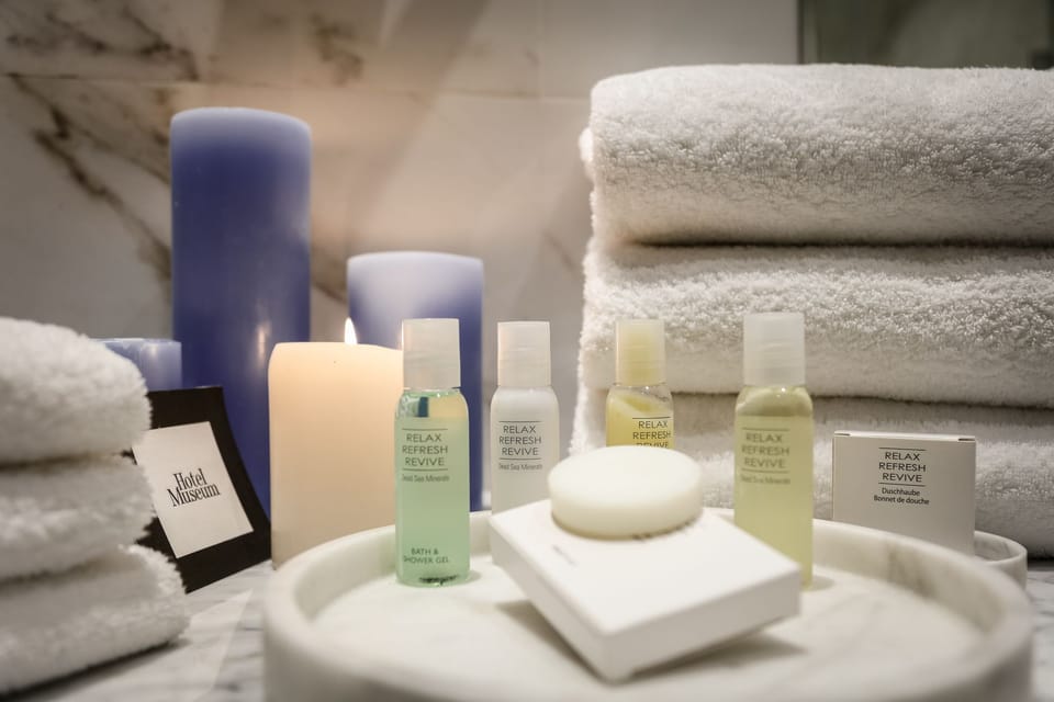 Designer toiletries, hair dryer, bathrobes, slippers