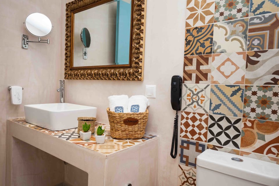 Shower, eco-friendly toiletries, hair dryer, bathrobes