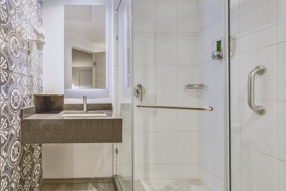Shower, eco-friendly toiletries, hair dryer, towels