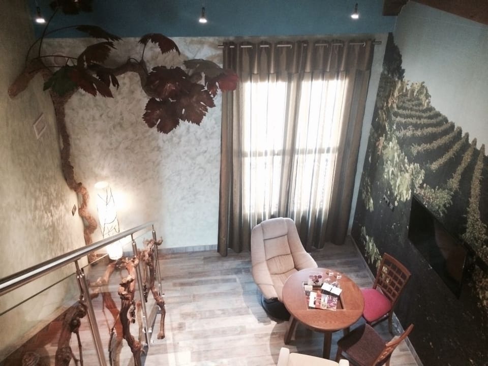 Superior Suite (Duplex) | Living area | 42-inch flat-screen TV with cable channels, TV