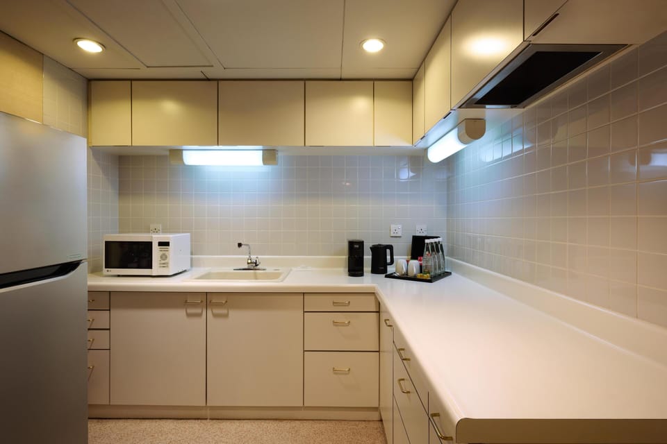 Mini-fridge, electric kettle, cookware/dishes/utensils