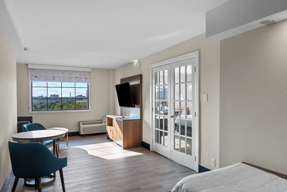 Suite, 1 King Bed (Canadian Skyline View) | Desk, laptop workspace, blackout drapes, iron/ironing board