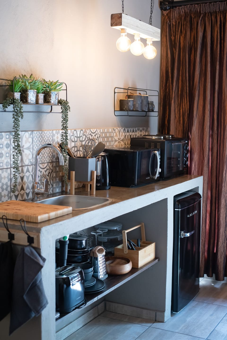 Deluxe Studio Suite | Private kitchen | Coffee/tea maker, electric kettle, cleaning supplies