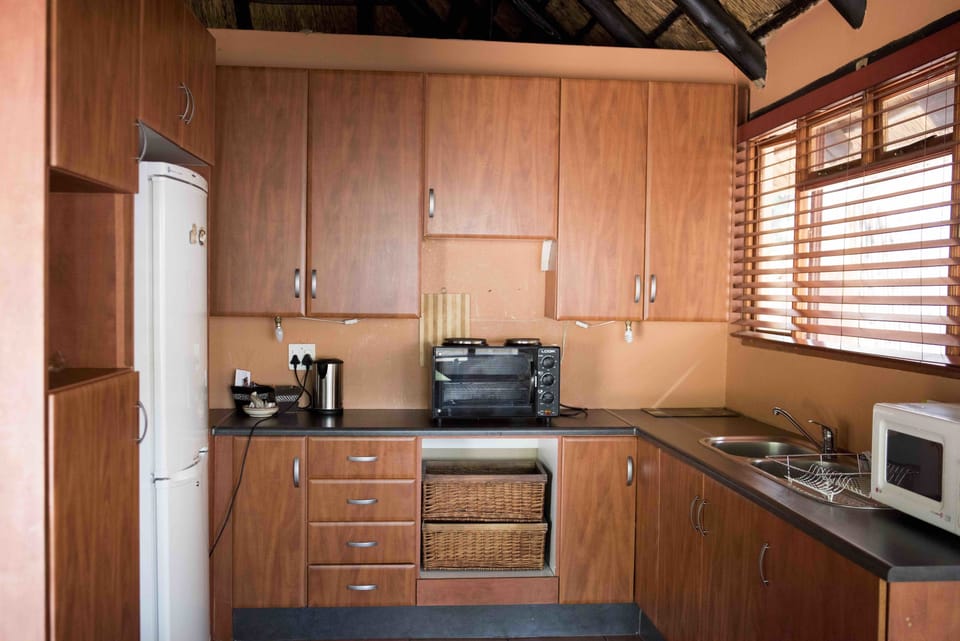 Apartment, 2 Bedrooms | Private kitchenette | Coffee/tea maker, electric kettle, cleaning supplies
