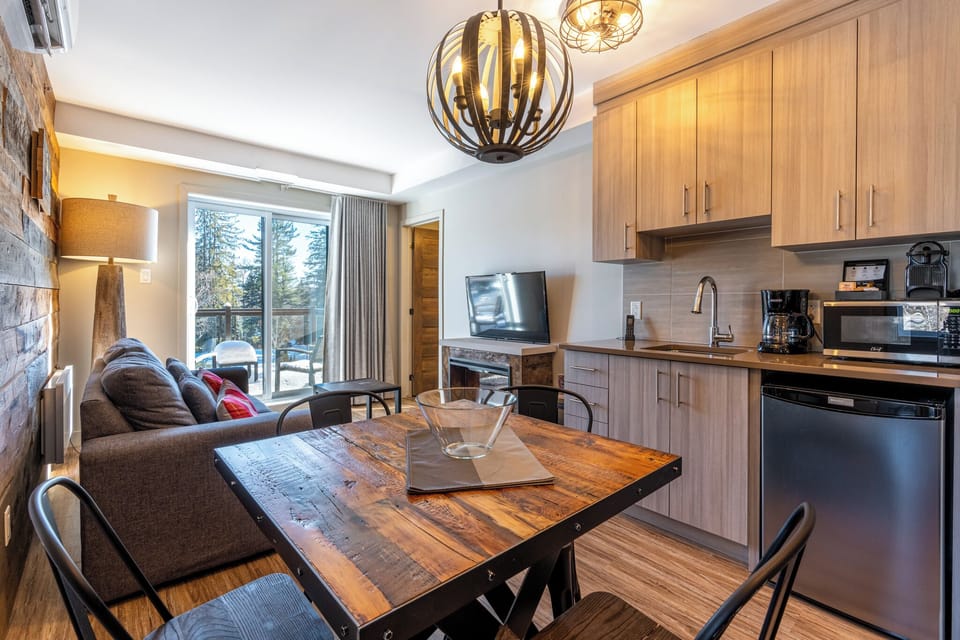 Spacious Studio Condo | Living area | 43-inch LED TV with cable channels, TV, fireplace