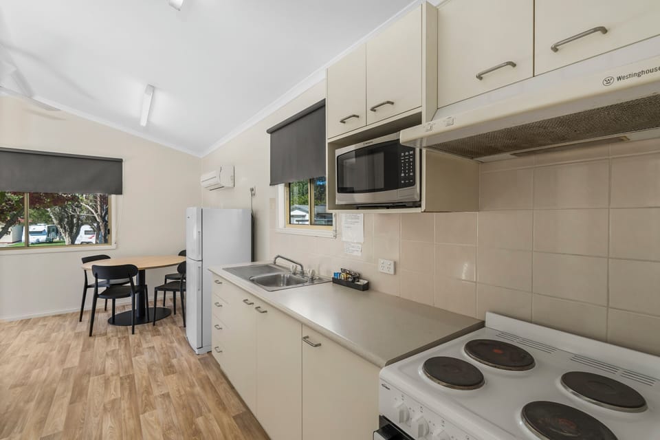 Standard 2 Bedroom Cabin | Private kitchen | Microwave, stovetop, toaster, cookware/dishes/utensils