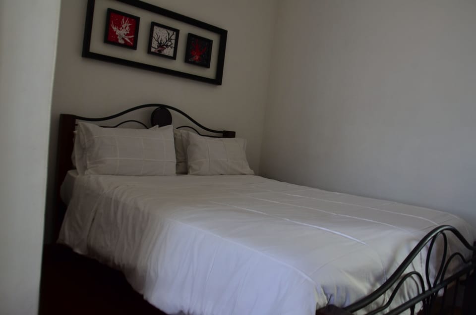 Premium bedding, desk, blackout drapes, iron/ironing board