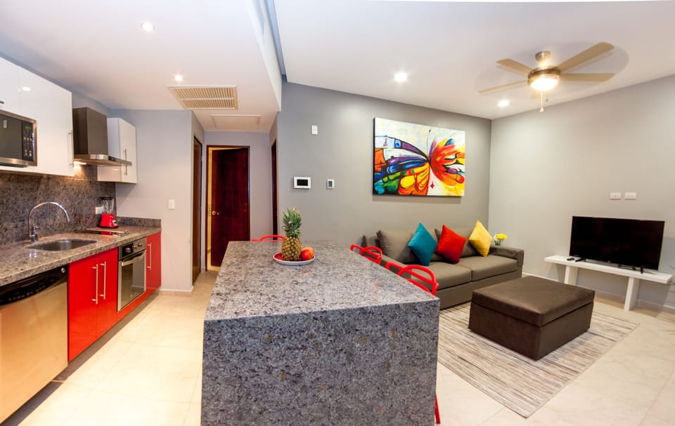 Deluxe Condo, 1 Bedroom, City View, Courtyard Area | Living area | Flat-screen TV