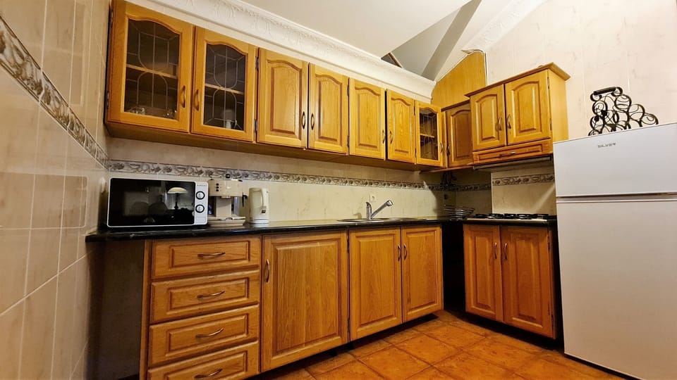 Fridge, microwave, stovetop, cookware/dishes/utensils