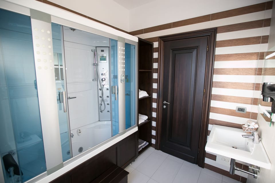 Shower, free toiletries, hair dryer, slippers
