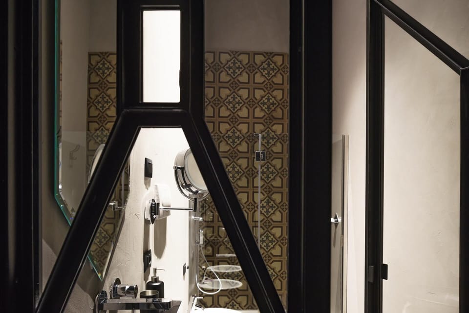 Junior Suite, Balcony, City View | Bathroom | Shower, rainfall showerhead, designer toiletries, hair dryer