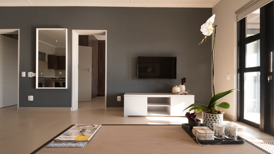 Basic Apartment, 1 Bedroom | Living area | 40-inch flat-screen TV with satellite channels, LED TV