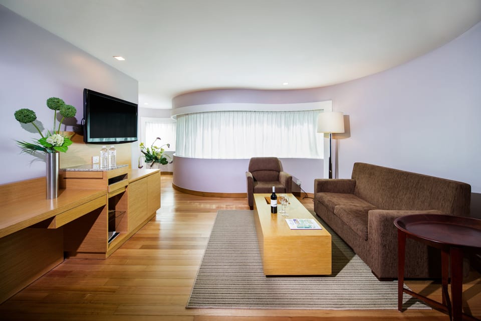 Executive Suite | Living area | 42-inch LCD TV with cable channels, TV