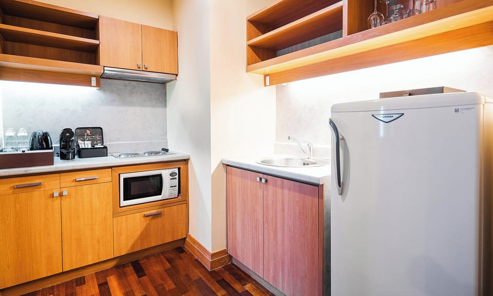 Room, 1 Bedroom (Residence, King) | Minibar, in-room safe, desk, blackout drapes