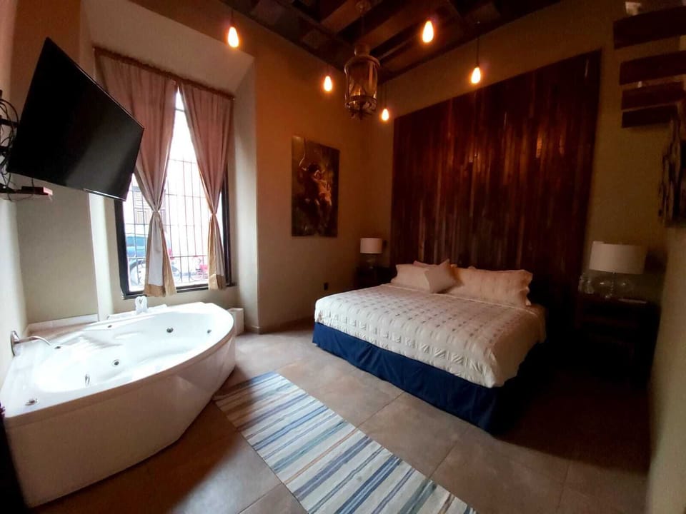 Design Suite, 1 Bedroom, Bathtub, Ground Floor | Premium bedding, down comforters, in-room safe, individually decorated