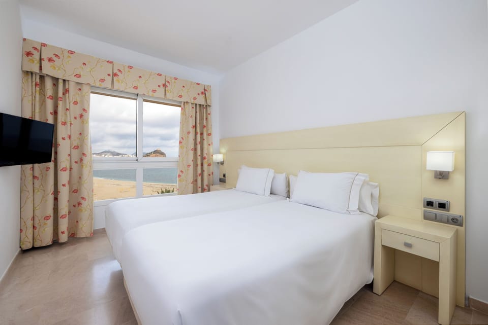 Suite, 2 Bedrooms, Sea View | In-room safe, desk, blackout drapes, free WiFi