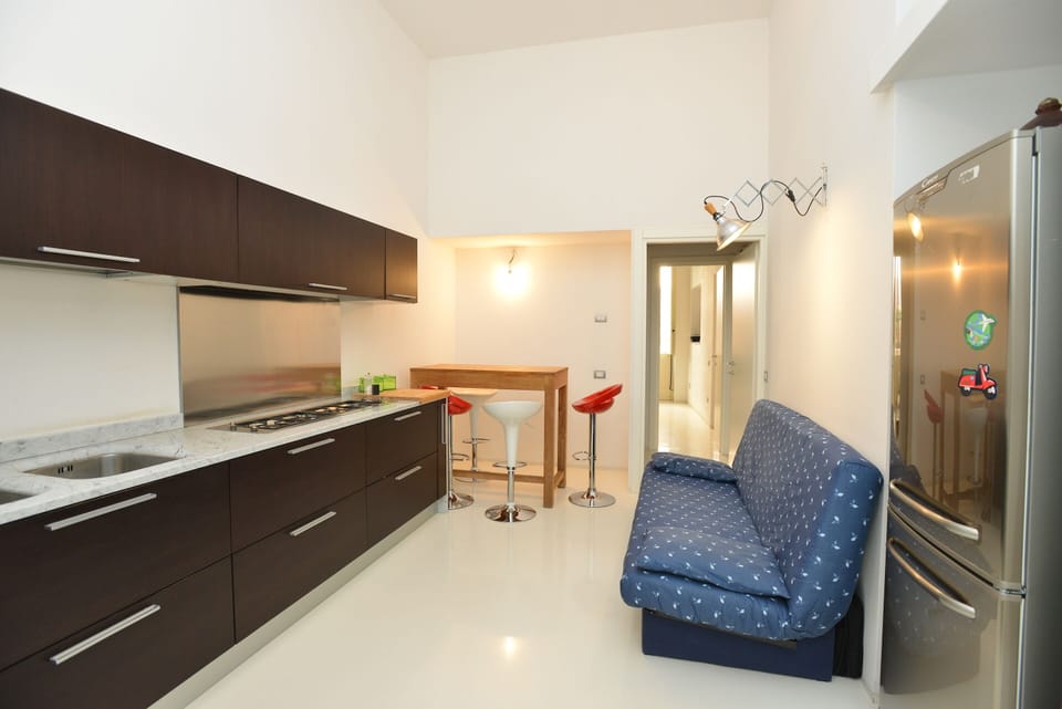 Deluxe Apartment | Living area | Flat-screen TV
