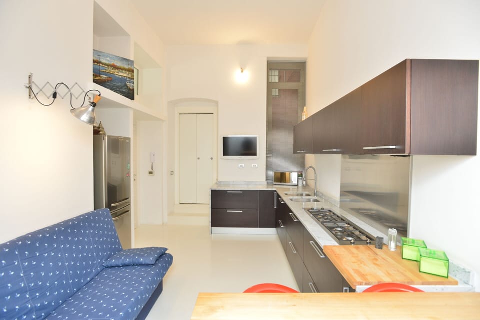 Deluxe Apartment | Living area | Flat-screen TV