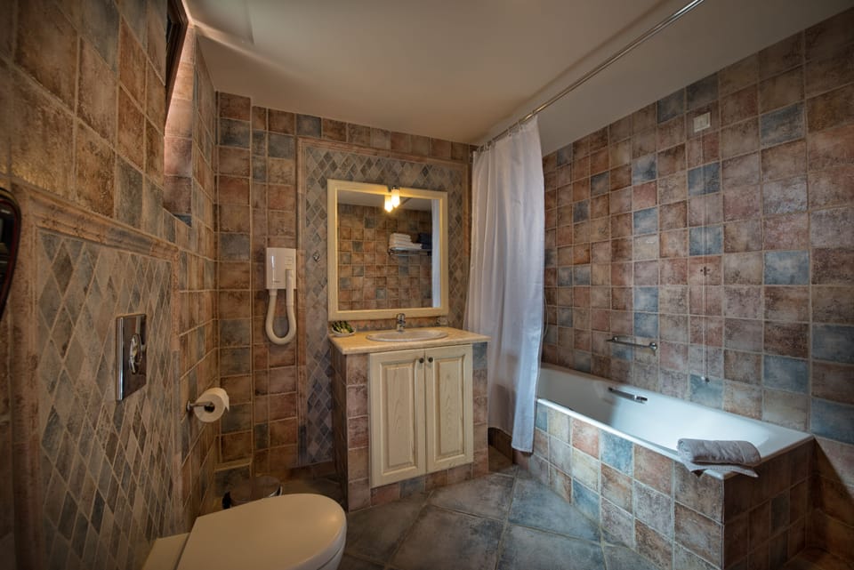 Double Room, Garden View | Bathroom | Free toiletries, hair dryer, slippers, towels