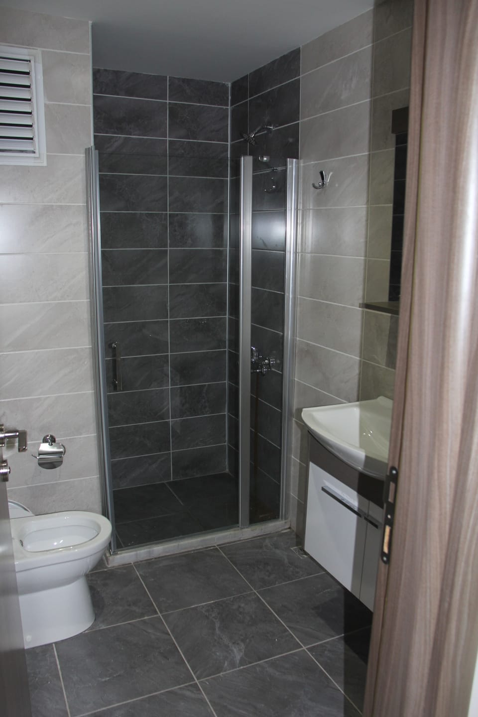 Shower, free toiletries, hair dryer, slippers