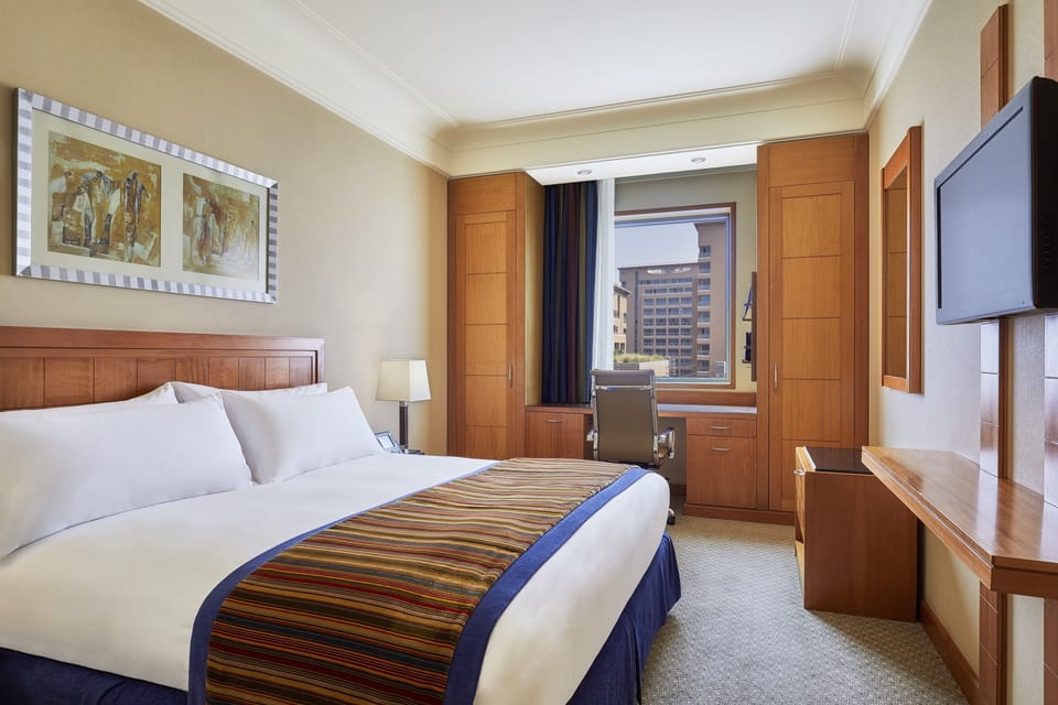Frette Italian sheets, premium bedding, down comforters, minibar