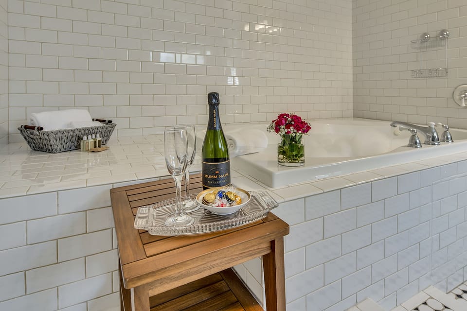 Suite, 1 King Bed, Jetted Tub (Helena) | Bathroom | Designer toiletries, hair dryer, towels