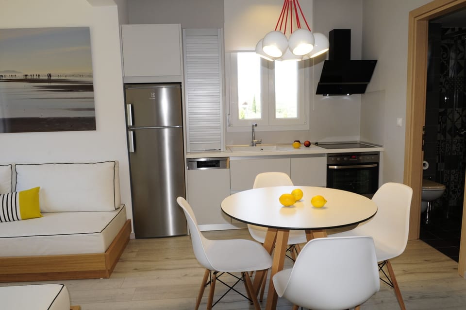Suite, 1 Bedroom | Private kitchen | Fridge, stovetop, coffee/tea maker, electric kettle