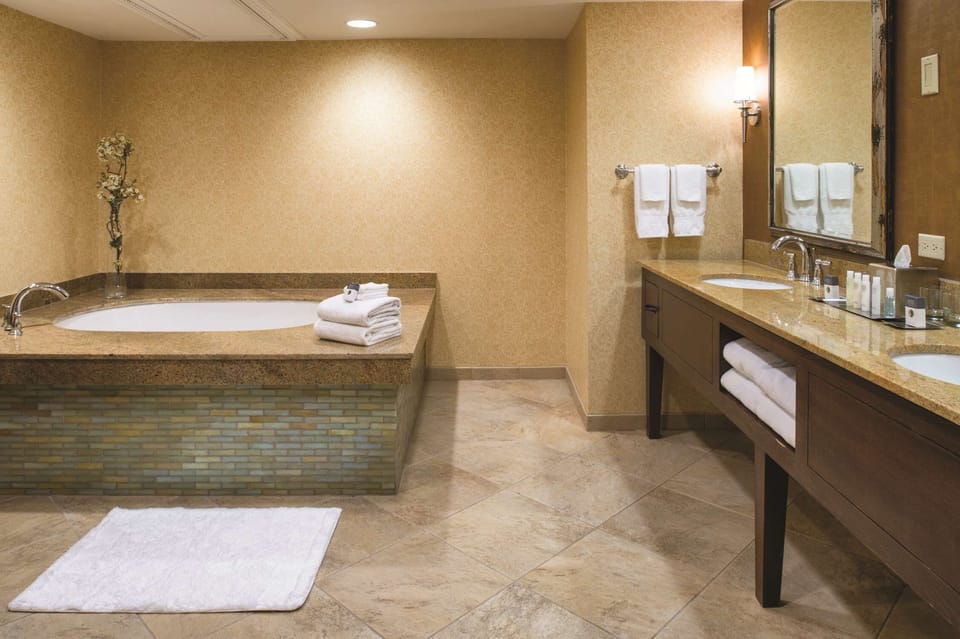 Designer toiletries, hair dryer, towels, soap