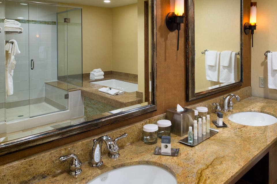 Designer toiletries, hair dryer, towels, soap