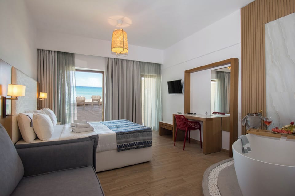 Junior Suite, 1 Queen Bed, Bathtub, Sea View | In-room safe, laptop workspace, soundproofing, free WiFi