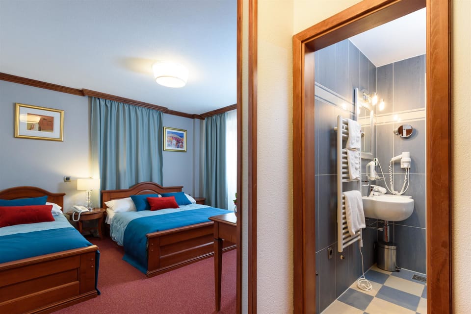 Triple Room | Living area | Flat-screen TV