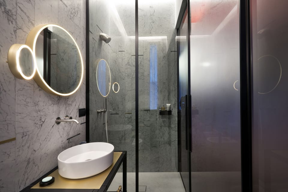 Shower, designer toiletries, hair dryer, bathrobes