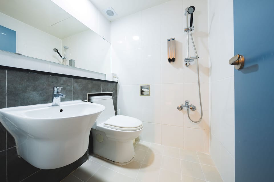 Triple Room | Bathroom | Shower, hair dryer, slippers, heated floors