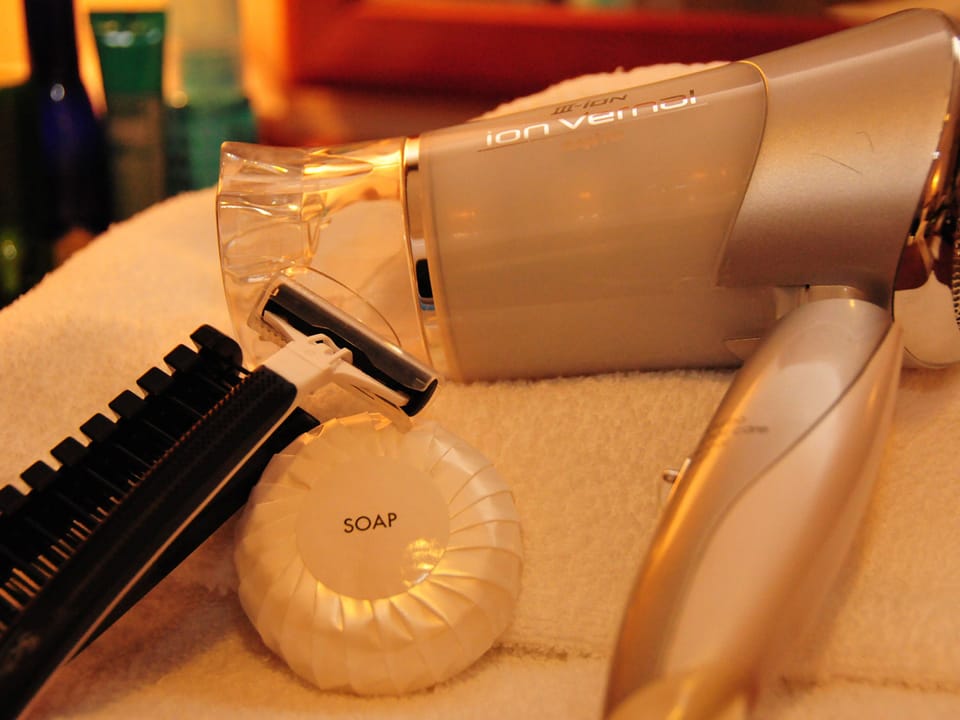 Combined shower/tub, free toiletries, hair dryer, slippers