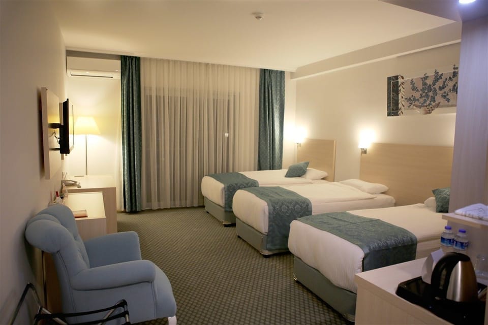 Family Triple Room, City View | Premium bedding, free minibar items, in-room safe, desk