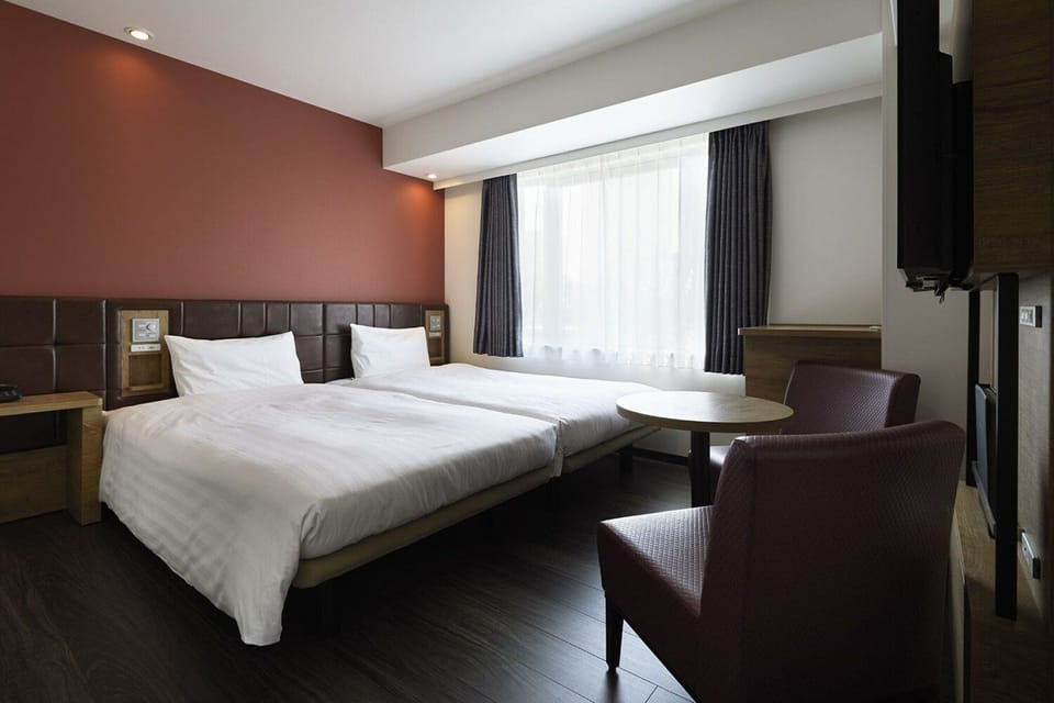 Twin Room, Non Smoking | Down comforters, desk, blackout drapes, free WiFi