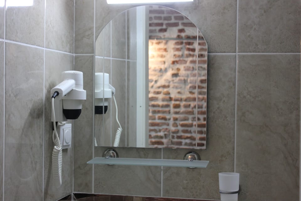 Shower, free toiletries, hair dryer, slippers