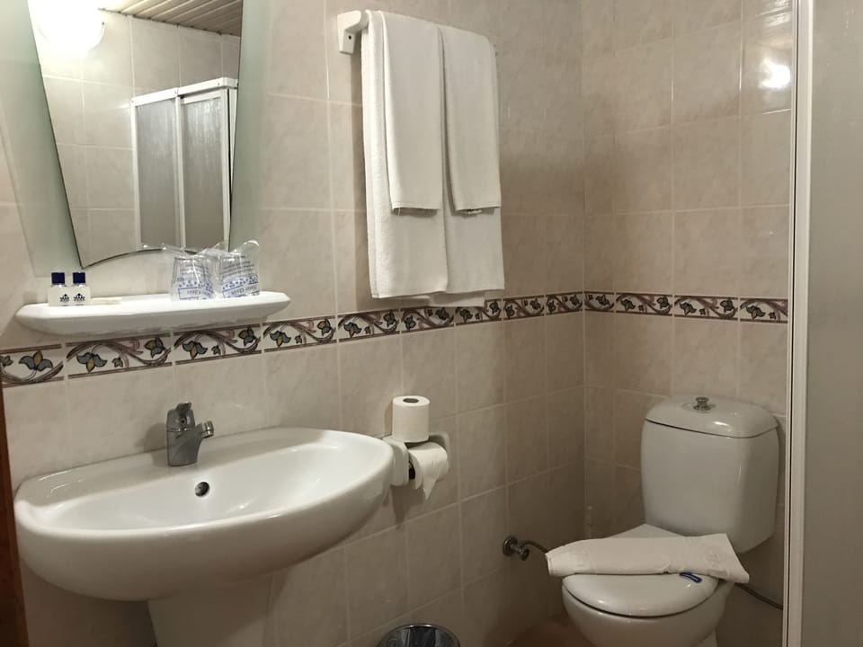 Economy Double Room, Balcony | Bathroom | Shower, free toiletries, hair dryer, towels