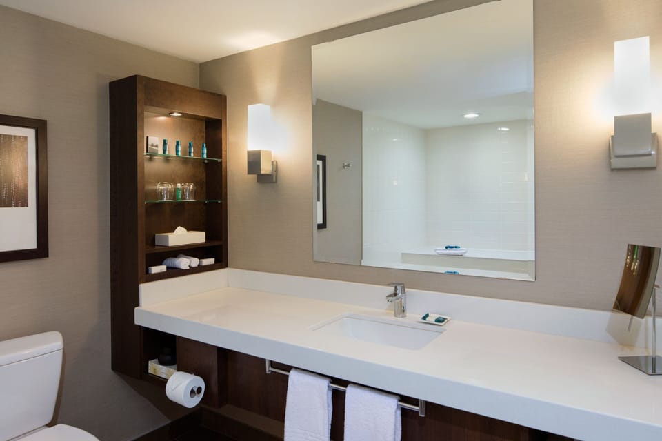 Separate tub and shower, designer toiletries, hair dryer, towels