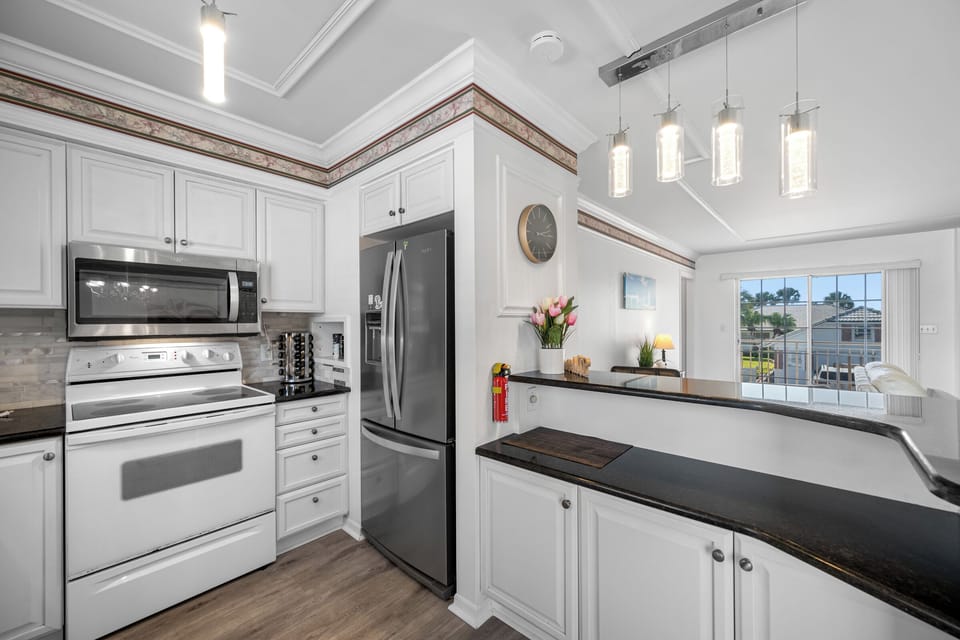Carousel Suites #10 | Private kitchen | Full-size fridge, microwave, coffee/tea maker, toaster