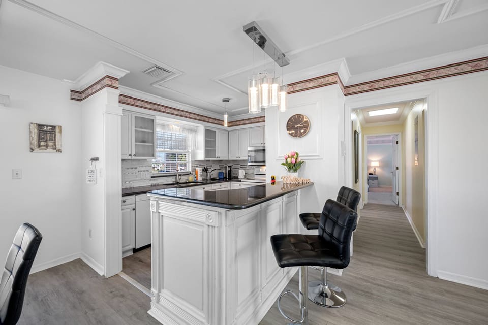 Carousel Suites #10 | Private kitchen | Full-size fridge, microwave, coffee/tea maker, toaster