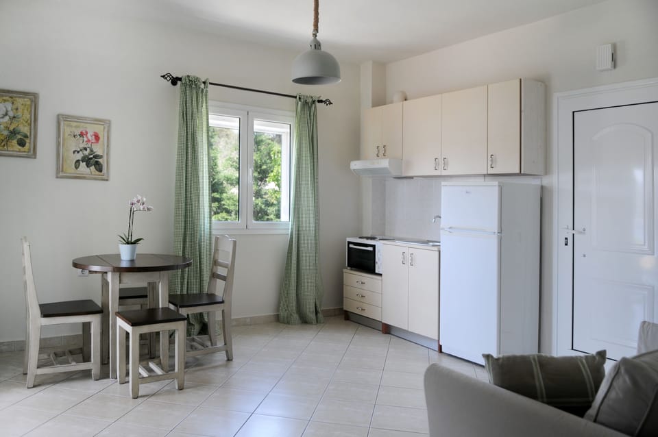 Apartment, 1 Bedroom, Sea View | Living area | TV