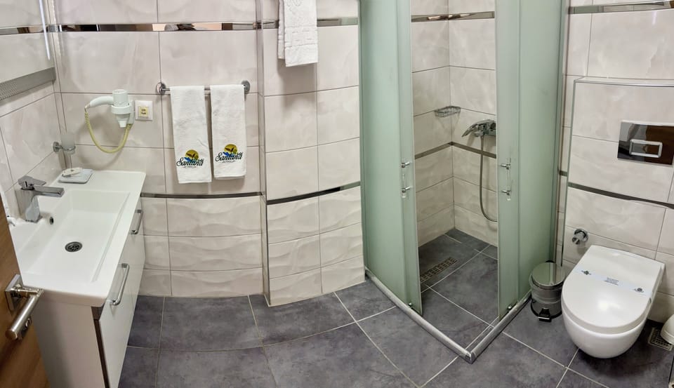 Shower, free toiletries, hair dryer, slippers