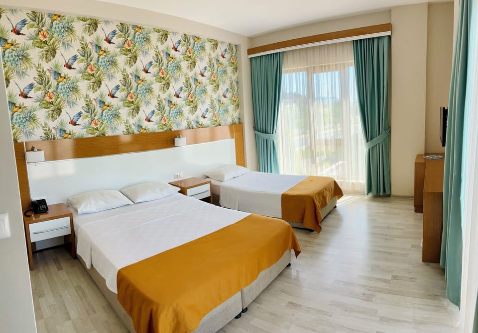 Family Room, Sea View | Minibar, in-room safe, desk, soundproofing