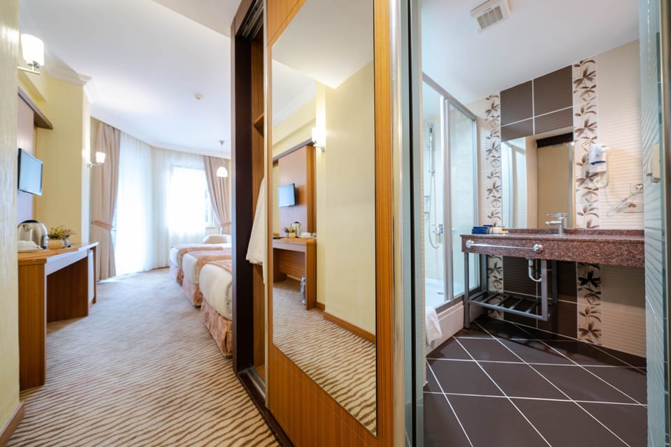 Standard Room | 1 bedroom, free minibar items, in-room safe, individually decorated