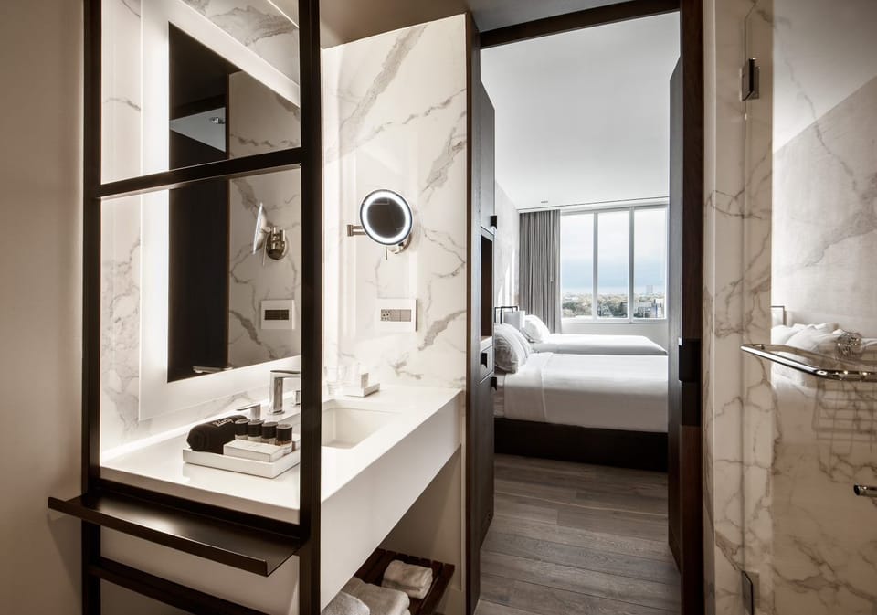 Deluxe Room, 2 Queen Beds | Bathroom | Rainfall showerhead, designer toiletries, hair dryer, bathrobes