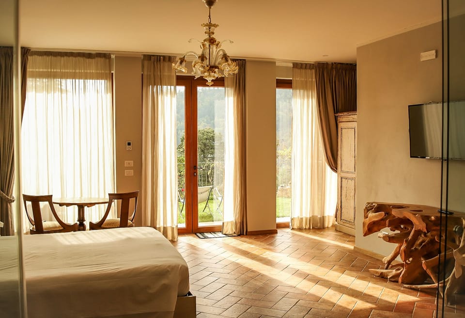 Suite, Sauna (Tuscany Spa Jetter Tub) | Down comforters, minibar, blackout drapes, bed sheets